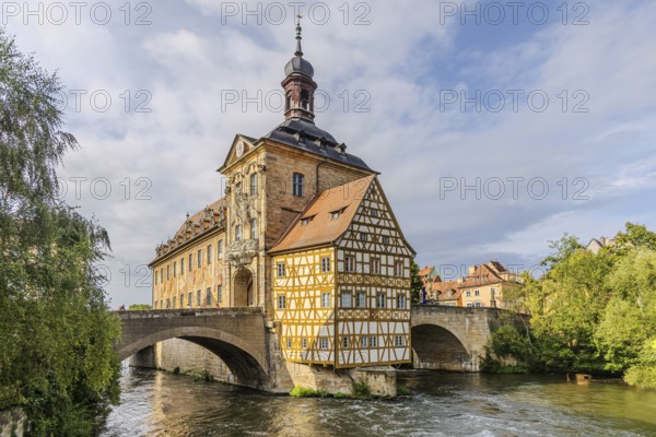 Old Town Hall on an artificial island in the River Regnitz. The landmark can be reached via two arched bridges. City view of Bamberg, Upper Franconia, Bavaria, Germany