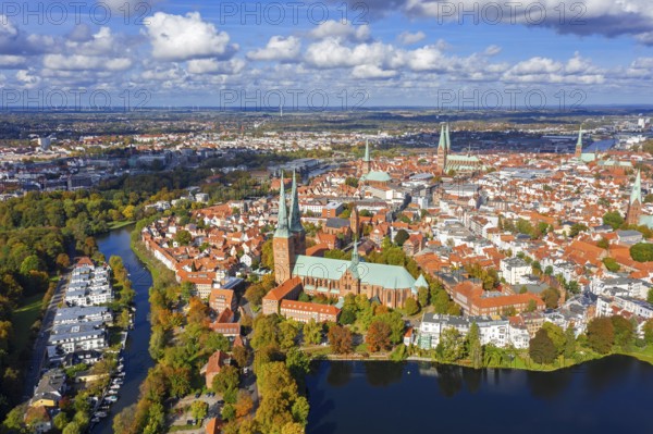 Aerial view over the river Trave and church towers in the old town of the Hanseatic City of Lübeck in autumn, fall, Schleswig-Holstein, Germany