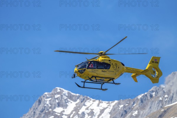 Rescue helicopter, emergency helicopter in flight, Schwaz, Tyrol, Austria