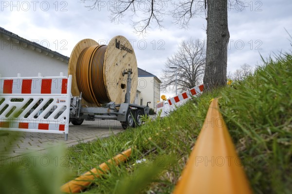 Rheinbach, North Rhine-Westphalia, Germany - Internet broadband expansion, construction site for laying fibre optic cable, cable drum with fibre optic cable, new construction of fibre optic routes on behalf of Telekom, fast Internet, DSL cable connection for households
