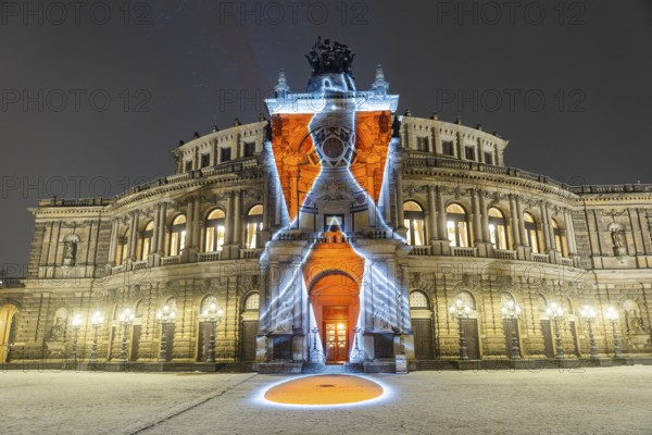 On 13 and 14 February 1945, Dresden was heavily destroyed in three Allied bombing raids. Every year, the people of Dresden commemorate this event at various events. A long human chain symbolises the protection of the city centre. With S?I?L?E?N?T?I?U?M?, OchoReSotto presents a video installation on the façade of the Semperoper that translates the architecture, history and gestures of the opera house into a haunting visual language. Historical fragments, architectural patterns and precisely documented movements merge into lively compositions that oscillate between dynamism and deliberate standstill, Dresden, Saxony, Germany