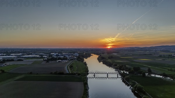 Wide river landscape with railway bridge in the middle, setting sunlight and extensive fields, Danube, Bogen, Lower Bavaria