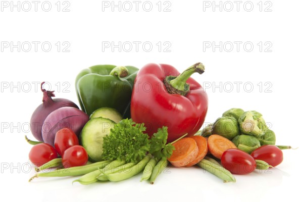 Still life with fresh vegetables isolated over white background
