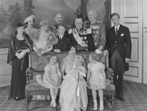 Märtha of Norway, 1901-1954, Swedish princess and crown princess of Norway. Daughter of Prince Carl of Sweden. Married in 1929 to Crown Prince Olav, later King Olav V of Norway. Here with the newly born Crown Prince Harald of Norway and daughters Ragnhild and Astrid. Behind Crown Princess Märtha stands her husband Crown Prince Olav. To his right are Märtha's father Prince Carl and his youngest son Prince Carl. Third from the left Märtha's mother, Princess Ingeborg and her sister Princess Margaretha. The year is 1937