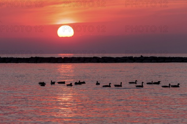 Sunset over Lake Huron as seen from the shoreline in Goderich, Ontario, Canada, North America