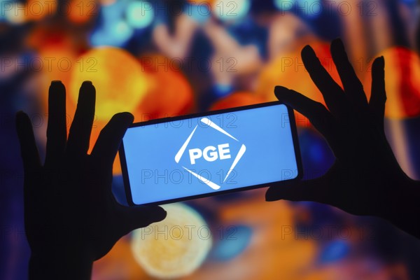 In this photo illustration, the Portland General Electric (PGE) logo is displayed on a smartphone mobile screen
