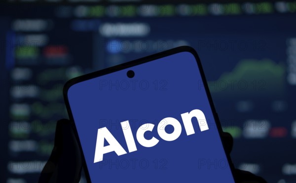 Alcon logo is displayed on smartphone. Alcon Inc. is a Swiss-American pharmaceutical and medical device company specializing in eye care products