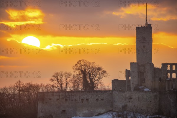 Königstein castle ruins at sunset. Viewpoint with a view over a village to a ruin in winter. Landscape photo of Königstein im Taunus, Hesse, Germany