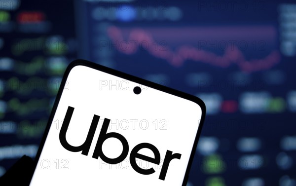 uber logo is displayed on smartphone. Uber Technologies, Inc. is an American multinational transportation company