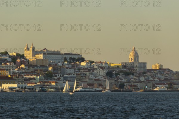 Lisbon City Center Skyline and Tagus River at Sunset. National Pantheon and Sailboats. Portugal