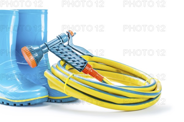 Garden tools rubber boots hose nad sprayer gun isolated
