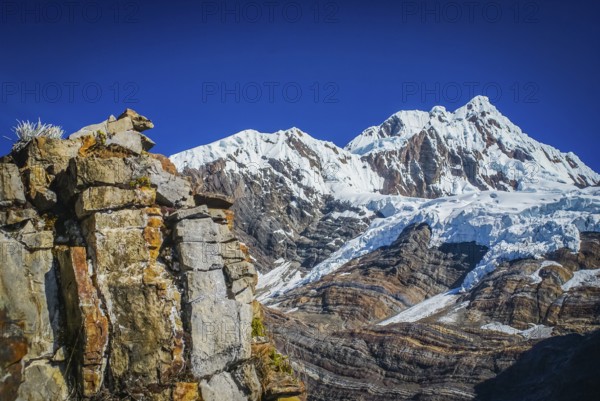 Photo of rocky mountains and Alpamayo, one of peaks of Peruvian Andes in Parque Nacional Huascaran in South America