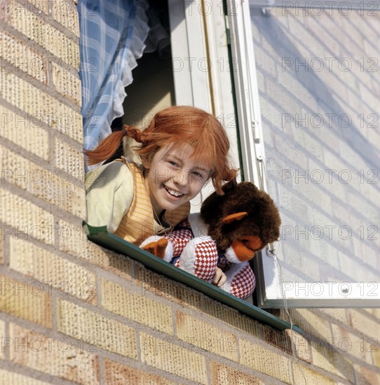 Inger Nilsson. Born in 1959. Swedish child actress known for playing the role of Pippi Longstocking in the TV series and movies based on the character of author Astrid Lindgren. Here dressed in Pippi clothes and the red hair in braids. A stuffed animal represents the monkey Herr Nilsson who appeared in the films. 17 February. 1970
