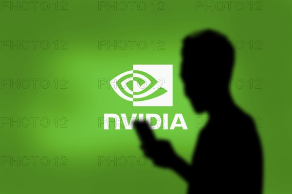 Nvidia logo on smartphone screen with AI in the background. Nvidia Corporation is an American multinational corporation and technology company.