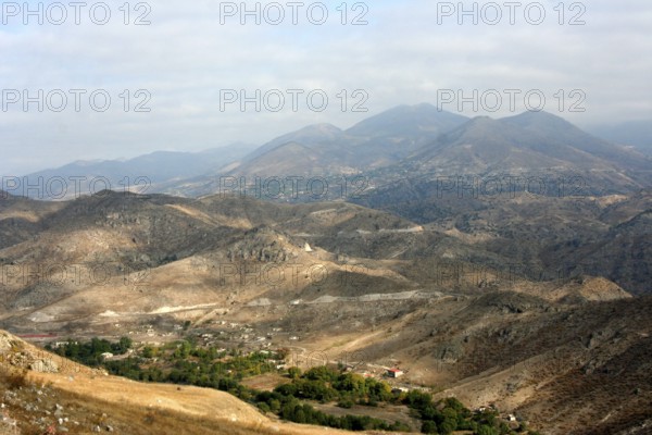 View of the independence-seeking Nagorno-Karabakh Republic from the road to Goris, buildings destroyed by the civil war can be seen in the valley