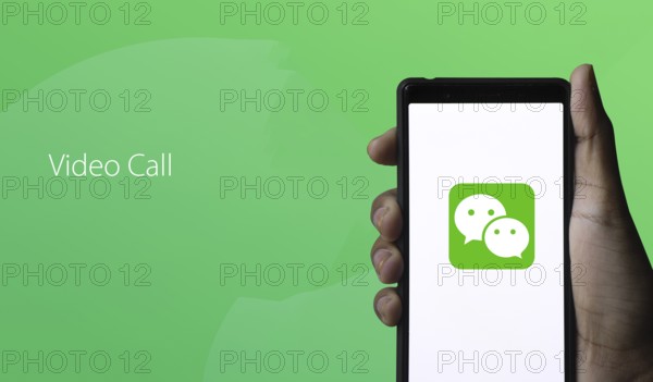 WeChat logo displayed on smartphone.