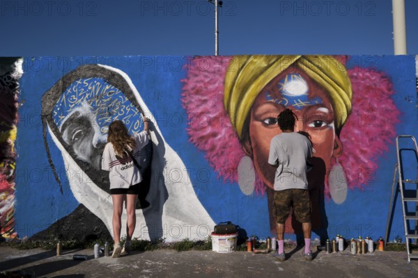 Germany, Berlin, 09.06.2024, Sunday afternoon in Mauerpark, Graffiti Wall (inner wall), Eme Freethinker, at work