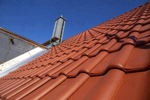 Close-up of a tiled roof that has just been tiled over
