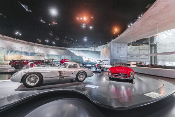 Mercedes-Benz 300 SLR Uhlenhaut Coupé from 1955. Two examples were built, one was auctioned. With proceeds of 135 million euros, it is the most valuable car in the world. The Mercedes-Benz Museum in Stuttgart presents a journey through the automotive history of the global corporation. The history of the Mercedes star begins with the first automobile in 1886. 160 vehicles are on display. Stuttgart, Baden-Württemberg, Germany