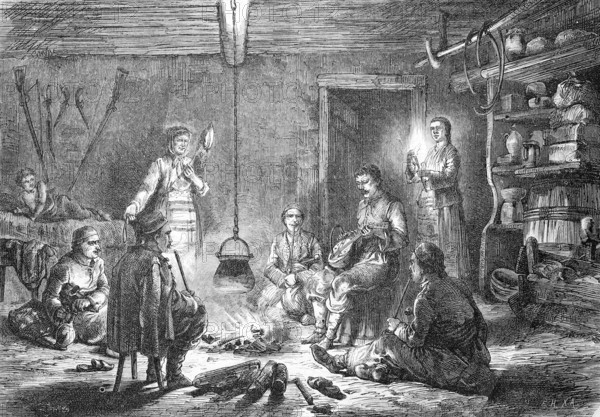 Family in their house in Dalmatia, open campfire in the room, simple conditions, historical, reproduction of a model with a scene from the 19th century