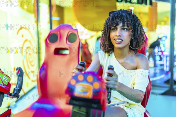 Young woman enjoying a vibrant day at the mall, immersed in the excitement of playing an arcade racing game surrounded by colorful lights