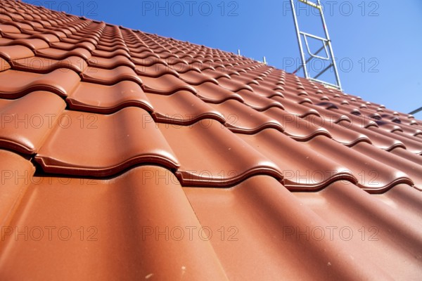 Close-up of a tiled roof that has just been tiled over