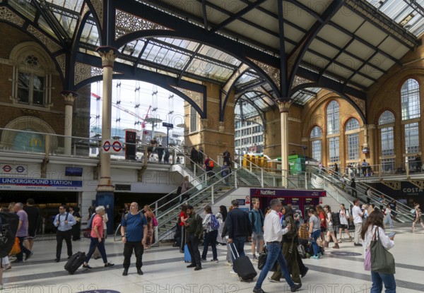 Concourse busy with passengers, Liverpool Street railway station, London, England, UK