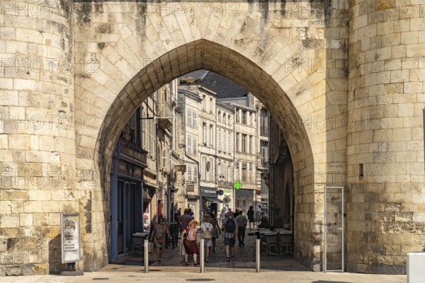 Entrance to the historic city centre through the Porte de la Grosse Horloge clock tower in La Rochelle, France