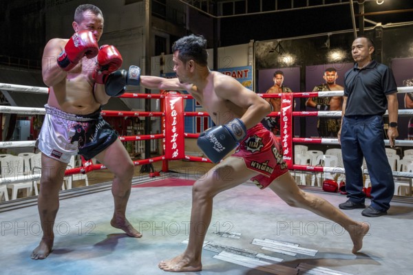 Thai boxing Muai Thai boxer in action, Pattaya, Thailand