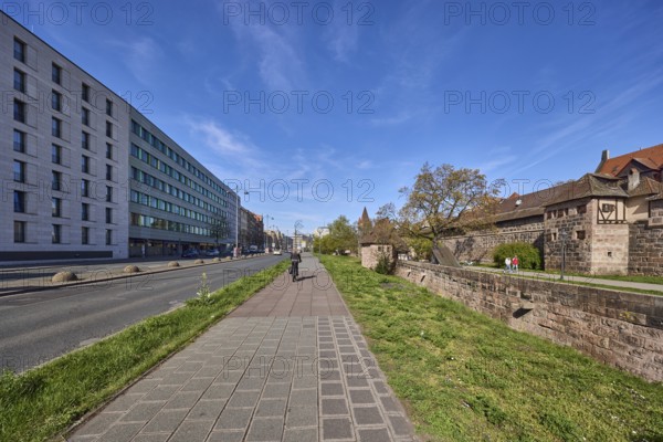 Footpath and cycle path, trees, meadow, city fortification, city wall, pedestrians and cyclists as secondary motif, blue sky, cirrostratus clouds, Frauentor wall, Frauentorgraben, Nuremberg, Middle Franconia, independent city, Bavaria, Germany
