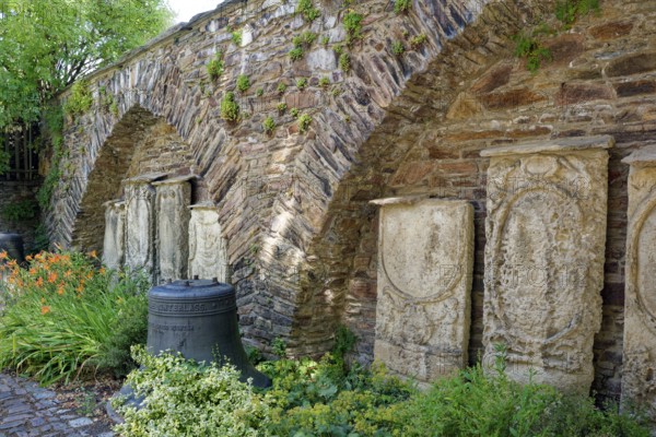 Remains of the town wall behind St Nicholas' Church with the gravestones of former priests of the town of Döbeln, Old Town, Döbeln, Saxony, Germany