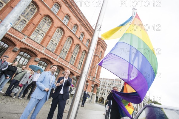 Florian Winkler-Schwarz, Managing Director of the Lesbian and Gay Federation (LSVD) Berlin Brandenburg and Kai Wegner (Governing Mayor of Berlin) at the raising of the rainbow flag for Pride Week in front of Berlin's Rotes Rathaus on 9 July 2025