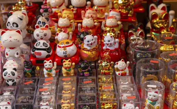 Waving lucky cats and pandas souvenirs, Chinatown, West End, London, England, UK