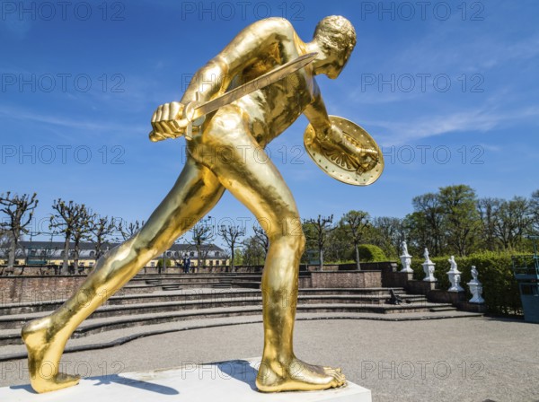 Golden sculpture, warrior with shield and sword, Herrenhausen Gardens, Baroque garden at castle Herrenhausen, Herrenhäuser Gärten, Hanover, Germany