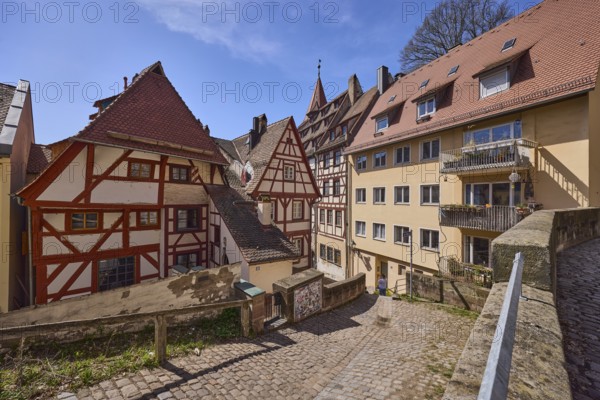 Historic half-timbered houses, residential buildings, gables, pointed roofs, sandstone wall, metal railing, footpath, cobblestones, blue sky, cirrostratus clouds, Am Ölberg, Obere Schmiedgasse, Nuremberg, Middle Franconia, independent city, Bavaria, Germany