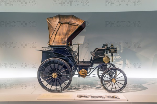 Daimler belt-driven car Vis-à-Vis from 1896. The Mercedes-Benz Museum in Stuttgart presents a journey through the automotive history of the global corporation. The history of the Mercedes star begins with the first automobile in 1886. 160 vehicles are on display. Stuttgart, Baden-Württemberg, Germany