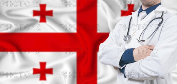 Georgia healthcare concept. Male doctor on Georgia flag. Doctor with crossed arms on Georgia flag