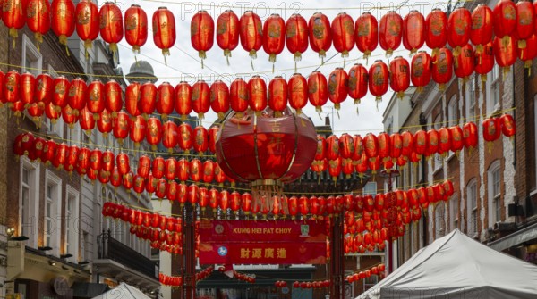Red Chinese lanterns crossing above Gerrard Street, Chinatown, West End, London, England, UK