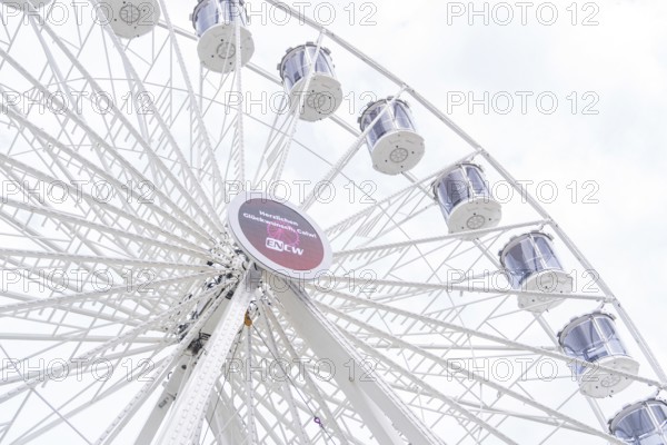 Mighty Ferris wheel with gondolas in front of a bright sky, Ferris wheel construction, Calw, Germany