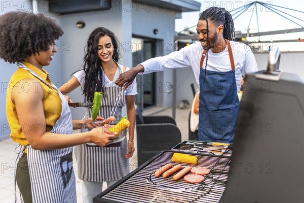 Chefs grilling delicious meats, sausages, corn, and peppers for a lively barbecue party on a rooftop, enjoying summer with friends