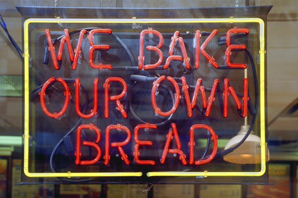 Illuminated advertising for a bakery, New York City, USA