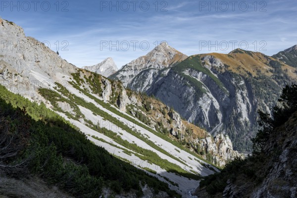 Narrow mountain valley, view of autumnal mountain landscape with mountain peaks Sonnjoch and Schaufelspitze, descent from Gamsjoch, Rißtal in the Eng, Karwendel, Tyrol, Austria