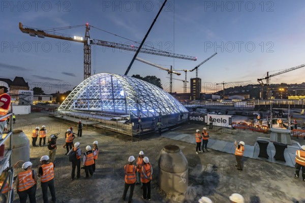 First entrance portal at the new Stuttgart main station completed. One of four so-called lattice shells, which travellers will use to access the underground through station in future, is revealed for the first time. The spectacular steel and glass construction was realised by façade specialist Seele and planned by christoph ingenhoven architects. Stuttgart, Baden-Württemberg, Germany