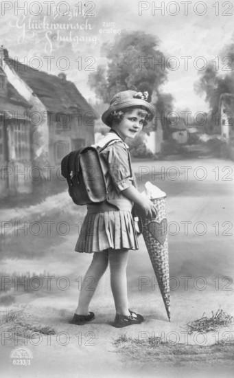 School enrolment, 1920s, A girl with a school bag looks back smiling on a country road, Historical photo