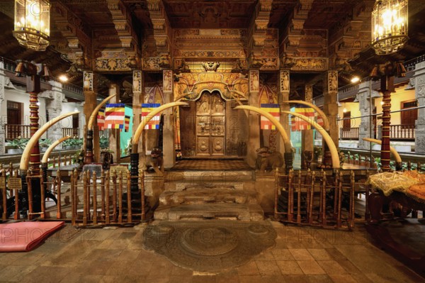 Temple of the sacred Tooth Relic or Sri Dalada Maligawa, Holy Shrine decorated with elephant tusks, Kandy, Sri Lanka