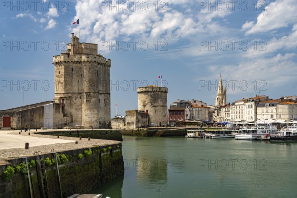 Harbour entrance to the old Vieux Port with the medieval towers Tour St.-Nicolas, Tour de la Lanterne and Tour de la Chaine, La Rochelle, France