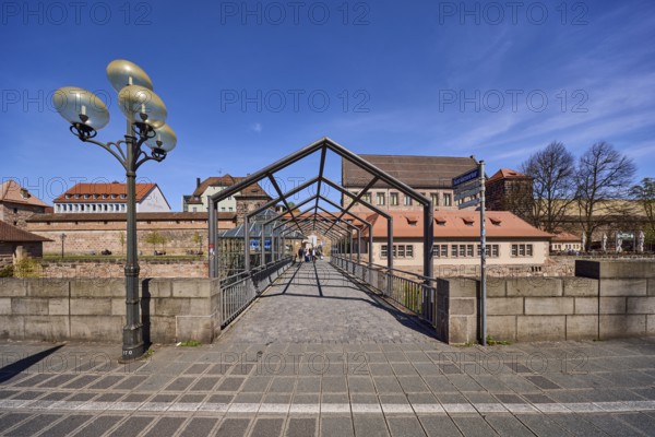 Pedestrian bridge, lantern, pavement, city fortification, city wall, historic buildings, trees, blue sky, cirrostratus clouds, Frauentor wall, Nuremberg, Middle Franconia, independent city, Bavaria, Germany