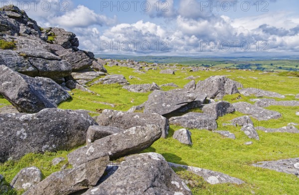 Stones and landscape at the top Tor tor rock hill in Dartmoor National Park. Widecombe-in-the-Moor, Bovey Tracey, Devon, South England, Great Britain