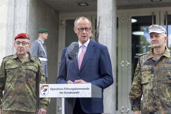 Friedrich Merz (Federal Chancellor, CDU) speaks between Carsten Breuer, Inspector General of the Bundeswehr (l.) and Alexander Sollfrank, Commander of the Operational Command (r.) during his first visit to the Operational Command of the Bundeswehr at the Henning-von-Tresckow Barracks in Schwielowsee near Potsdam on 28 June 2025