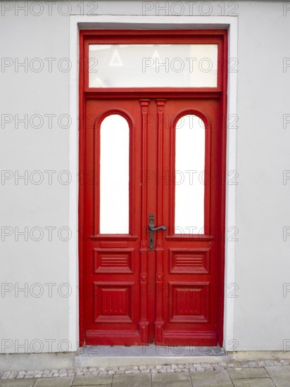 A red entrance door, Mecklenburg-Vorpommern, Germany